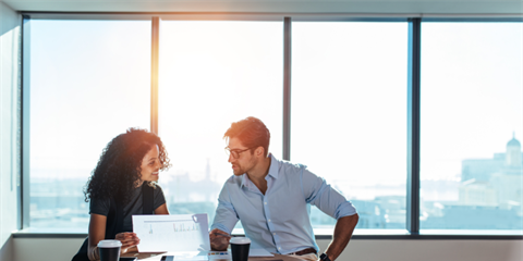 people looking at paperwork